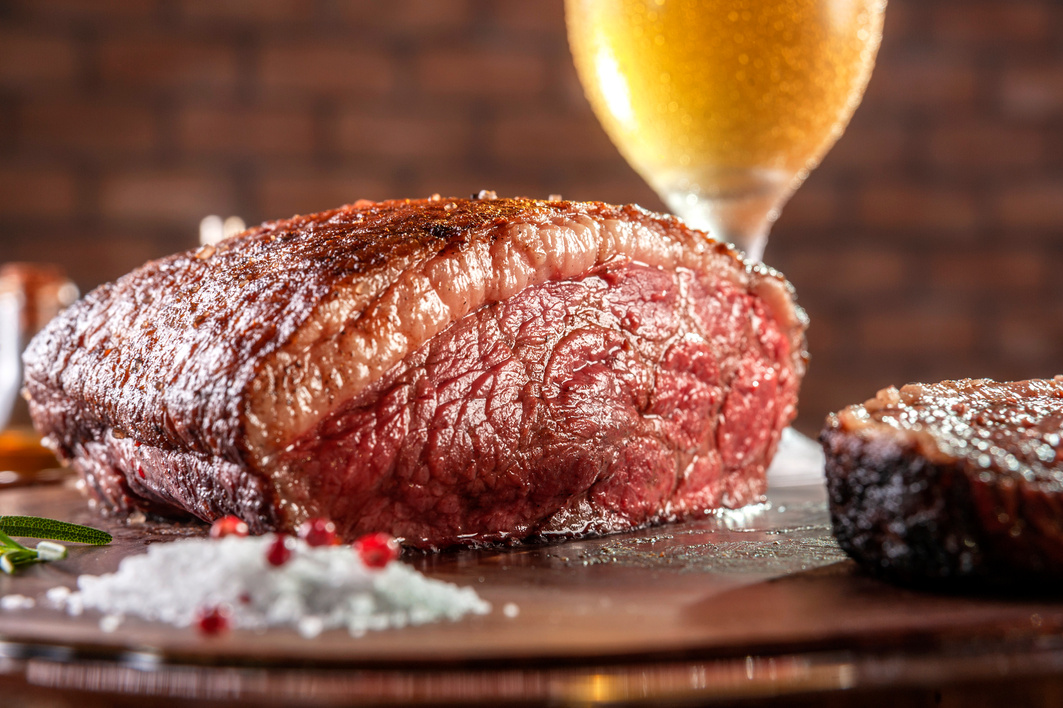 Grilled cap rump steak and beer (brazilian picanha)